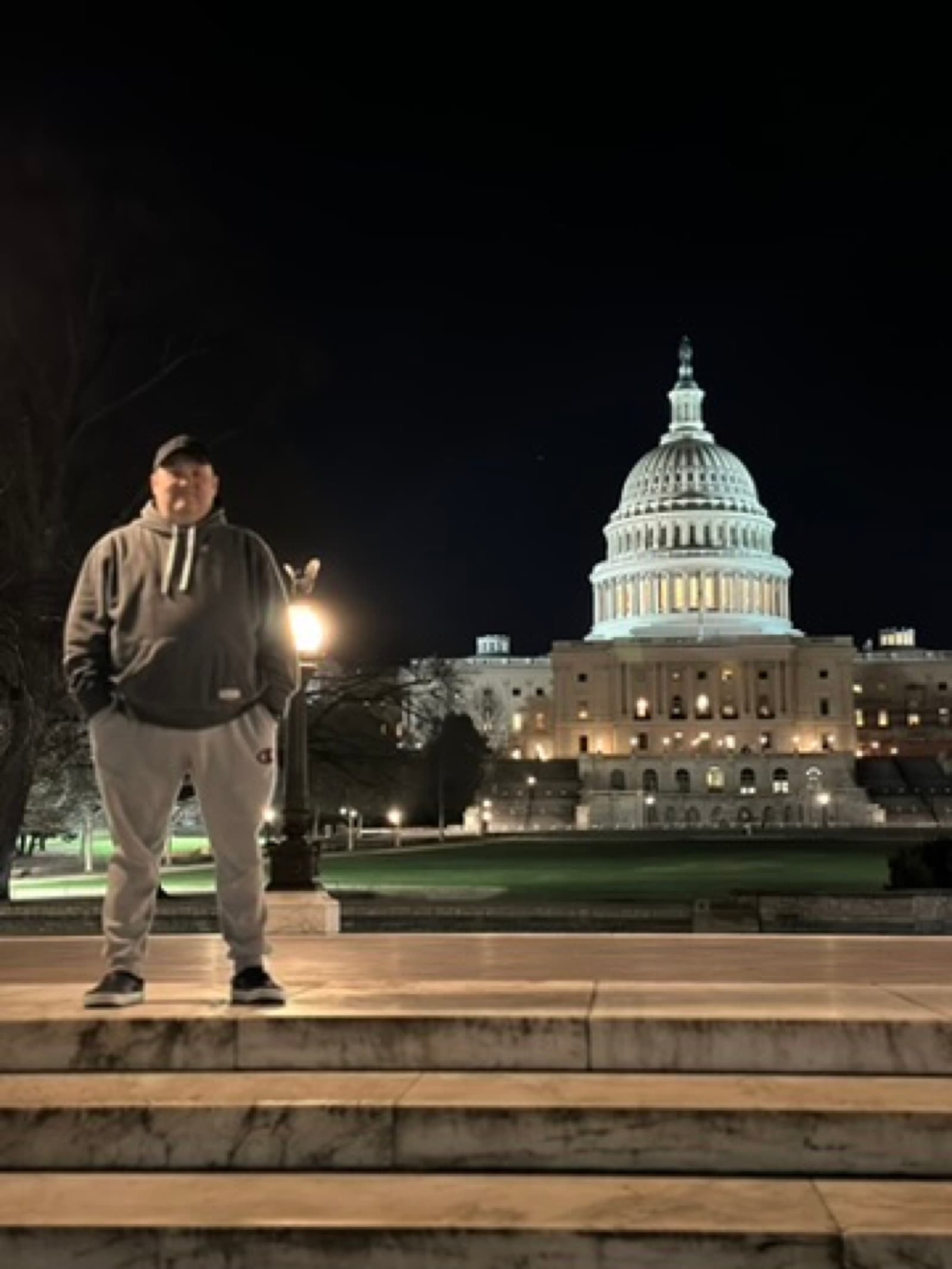 On the steps of the U.S. Capitol at night
