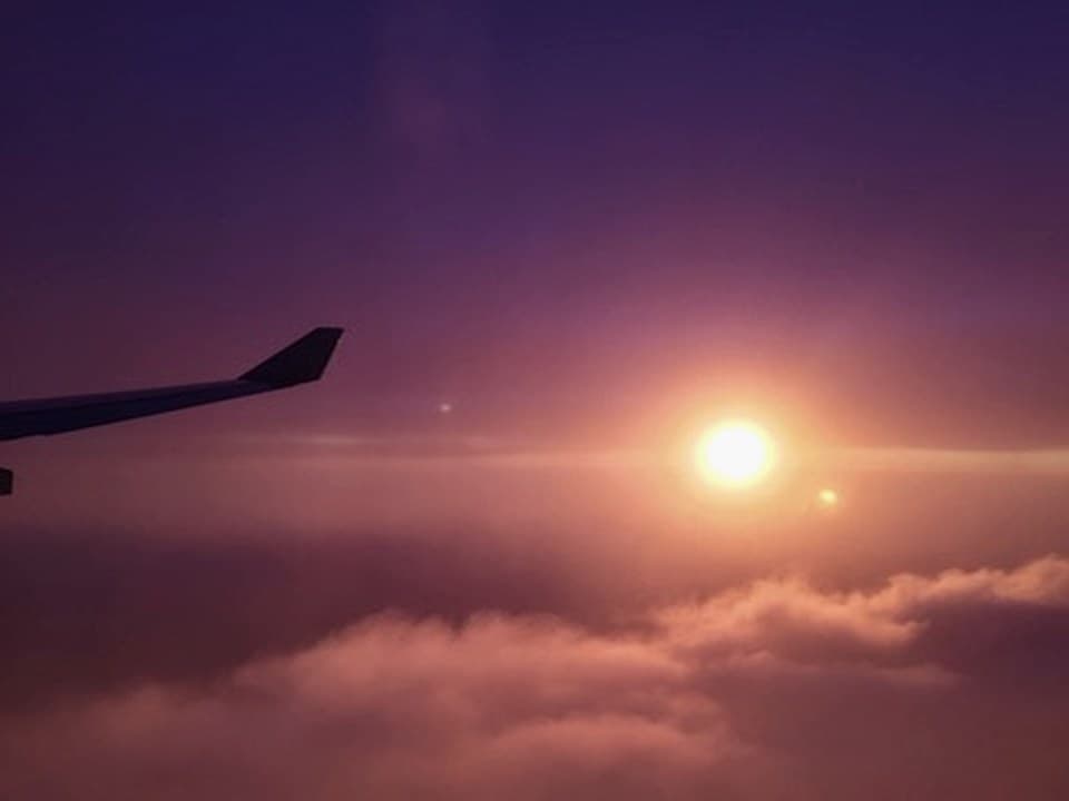 Long-haul wing view at sunset
