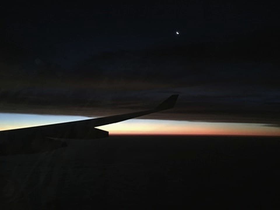 Crescent moon and sunrise approach