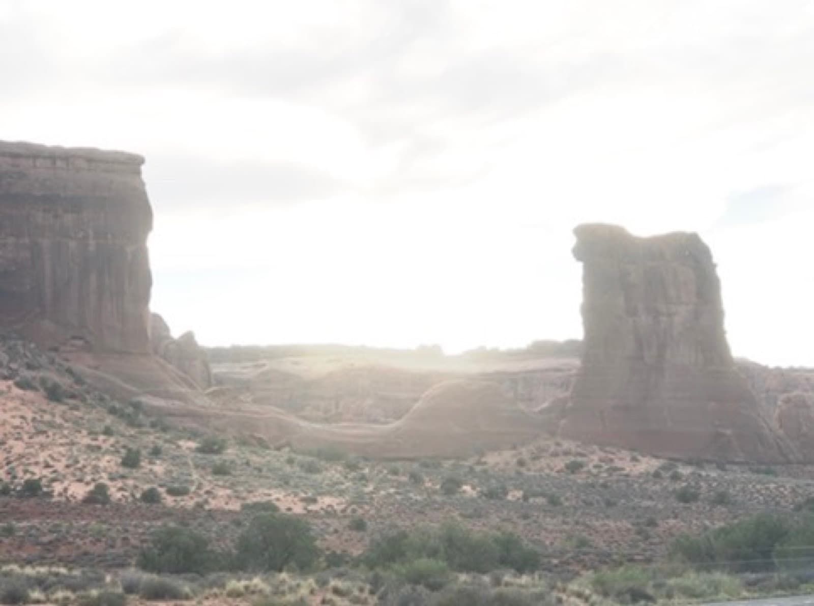 Arches towers with morning sun glare