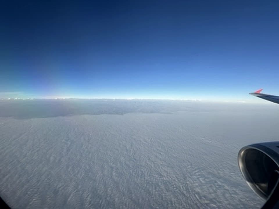 Over the clouds, LATAM to Lima